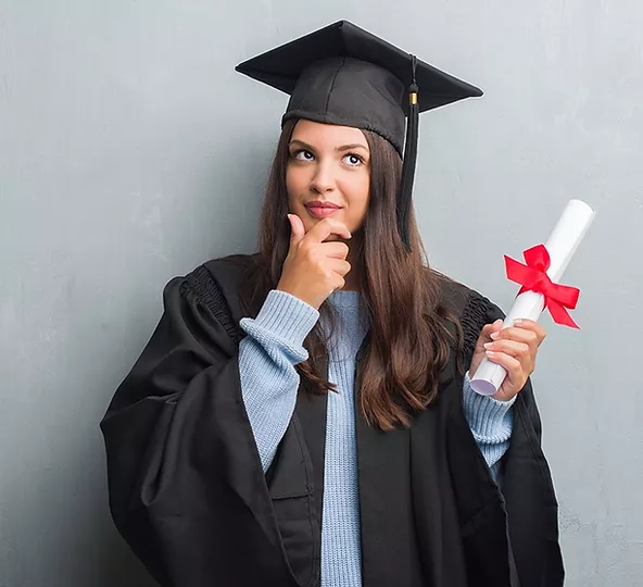 woman wearing a graduation robe and holding a master degree